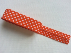 Gepunktetes Schr�gband als 2m-St�ck, orange-wei�