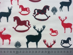 Baumwollstoff weihnachtliche Hirsche & Schaukelpferde, cremeweiss