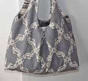 Dekostoff Ornamente grau melange/natur